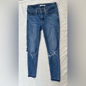 Levi’s Y2K 711 Skinny Medium Blue Wash Low Rise Distressed Denim Raw Hem 24